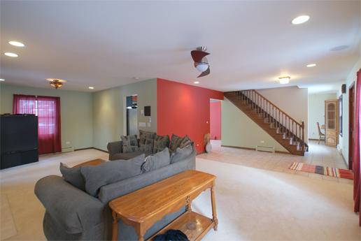 23740 North High Ridge Drive Lake Zurich, IL 60047 - Photo 5 of 17 a living room with furniture and a ceiling fan