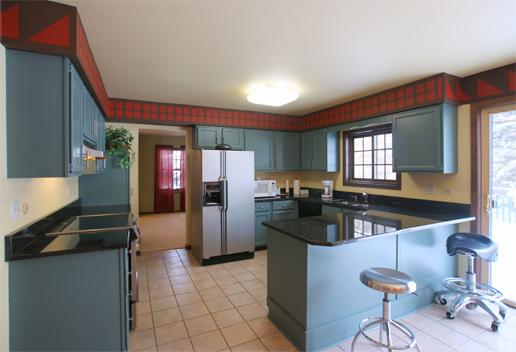 23740 North High Ridge Drive Lake Zurich, IL 60047 - Photo 8 of 17 a kitchen with refrigerator and cabinets