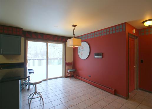 23740 North High Ridge Drive Lake Zurich, IL 60047 - Photo 9 of 17 a view of a room with wooden floor and exposed radiator
