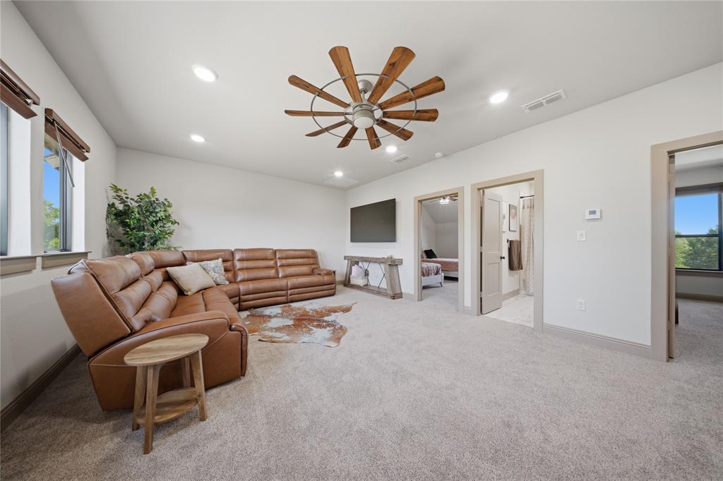 958 Cedar Mills Road Gordonville, TX 76245 - Photo 28 of 40 a living room with furniture a ceiling fan and a rug