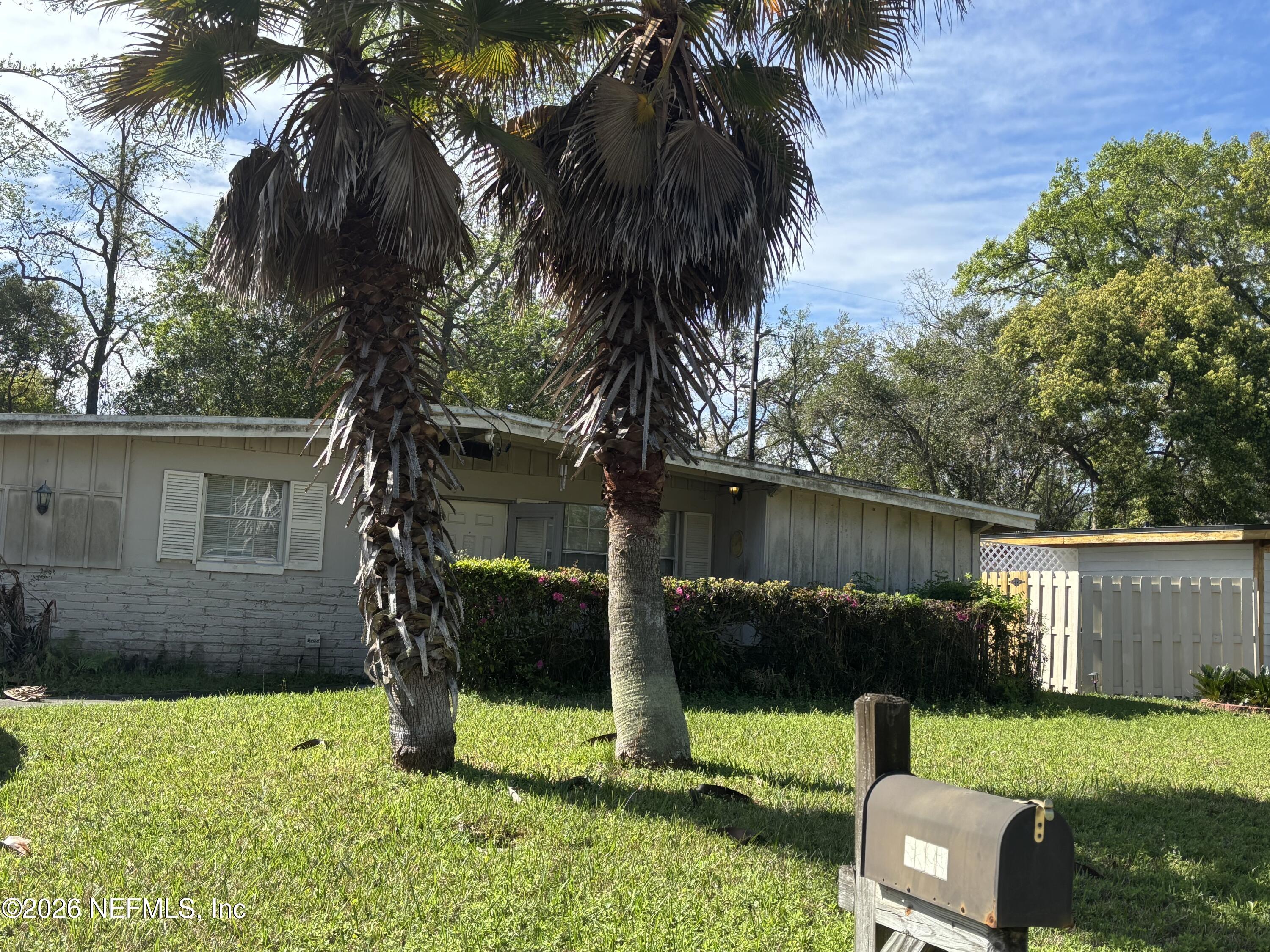 6928 Arques Road Jacksonville, FL 32205 - Photo 1 of 1 front view of a house with a yard