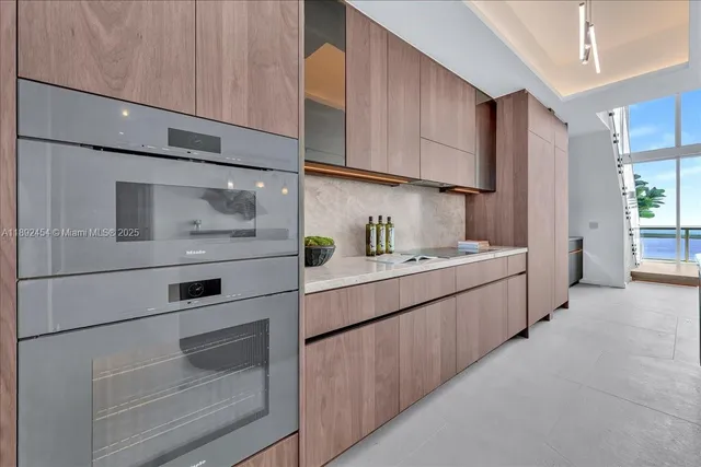 a view of a hallway with washer and dryer