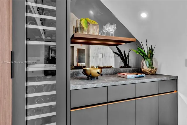 a dining room with furniture and a chandelier
