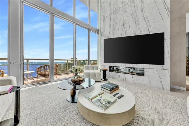 a hotel room with bed and a flat screen tv