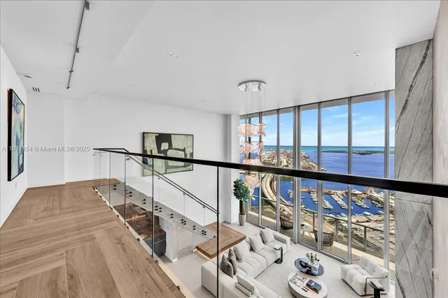 a spacious bedroom with a bed and glass window