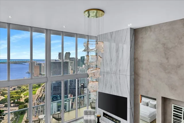 a spacious bedroom with a bed and a couch