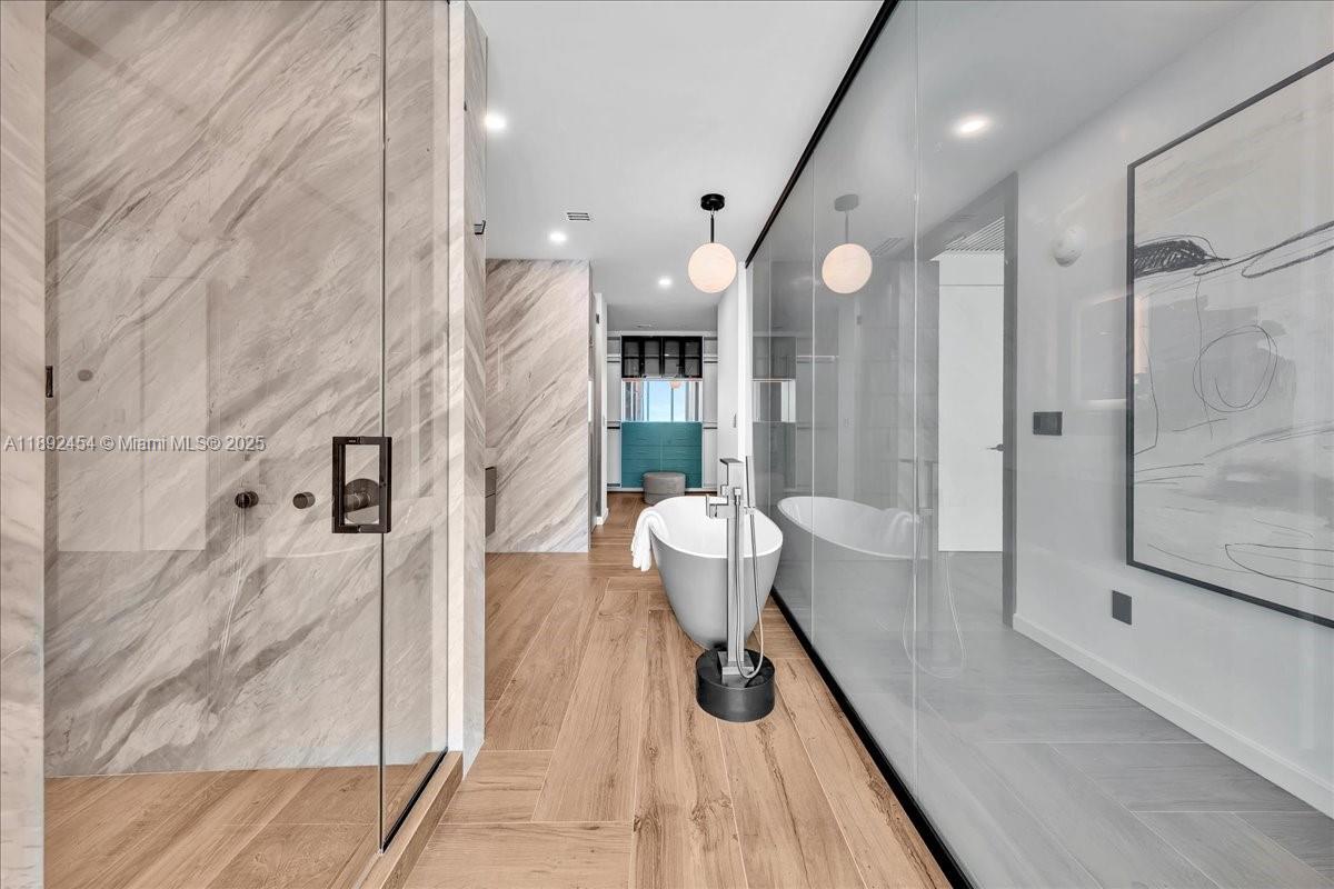 888 Biscayne Boulevard, Unit PH5704 Miami, FL 33132 - Photo 49 of 62 a bathroom with a sink and shower