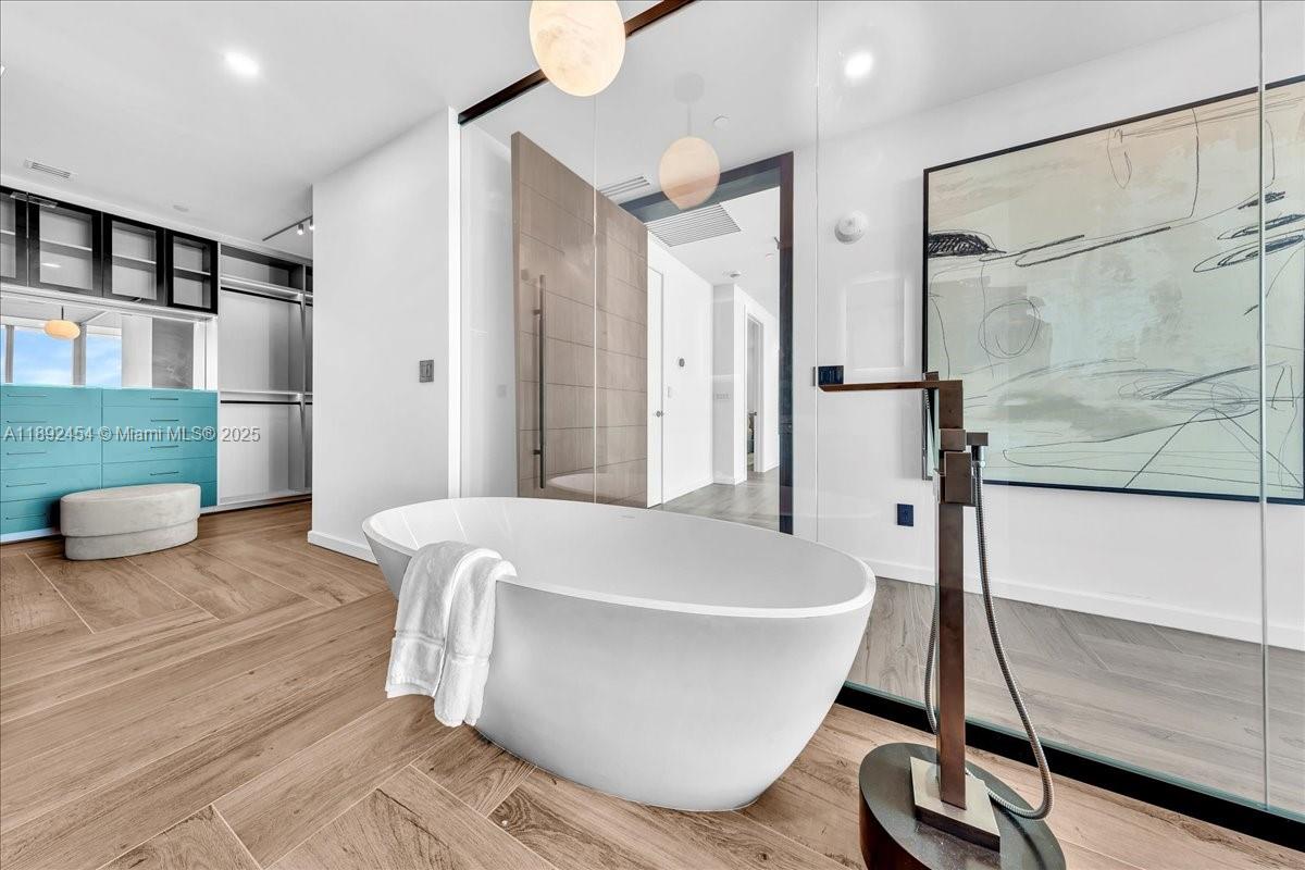 888 Biscayne Boulevard, Unit PH5704 Miami, FL 33132 - Photo 54 of 62 a white bath tub sitting in a bathroom
