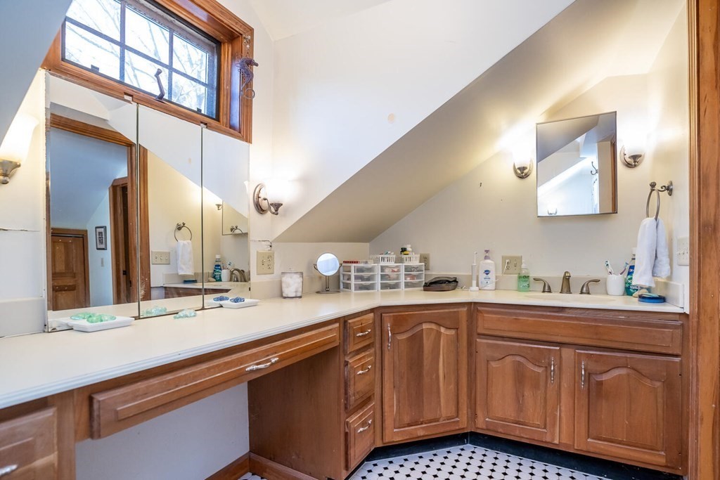 101 Riverside Drive Northampton, MA 01062 - Photo 33 of 42 a bathroom with a sink a vanity and a mirror