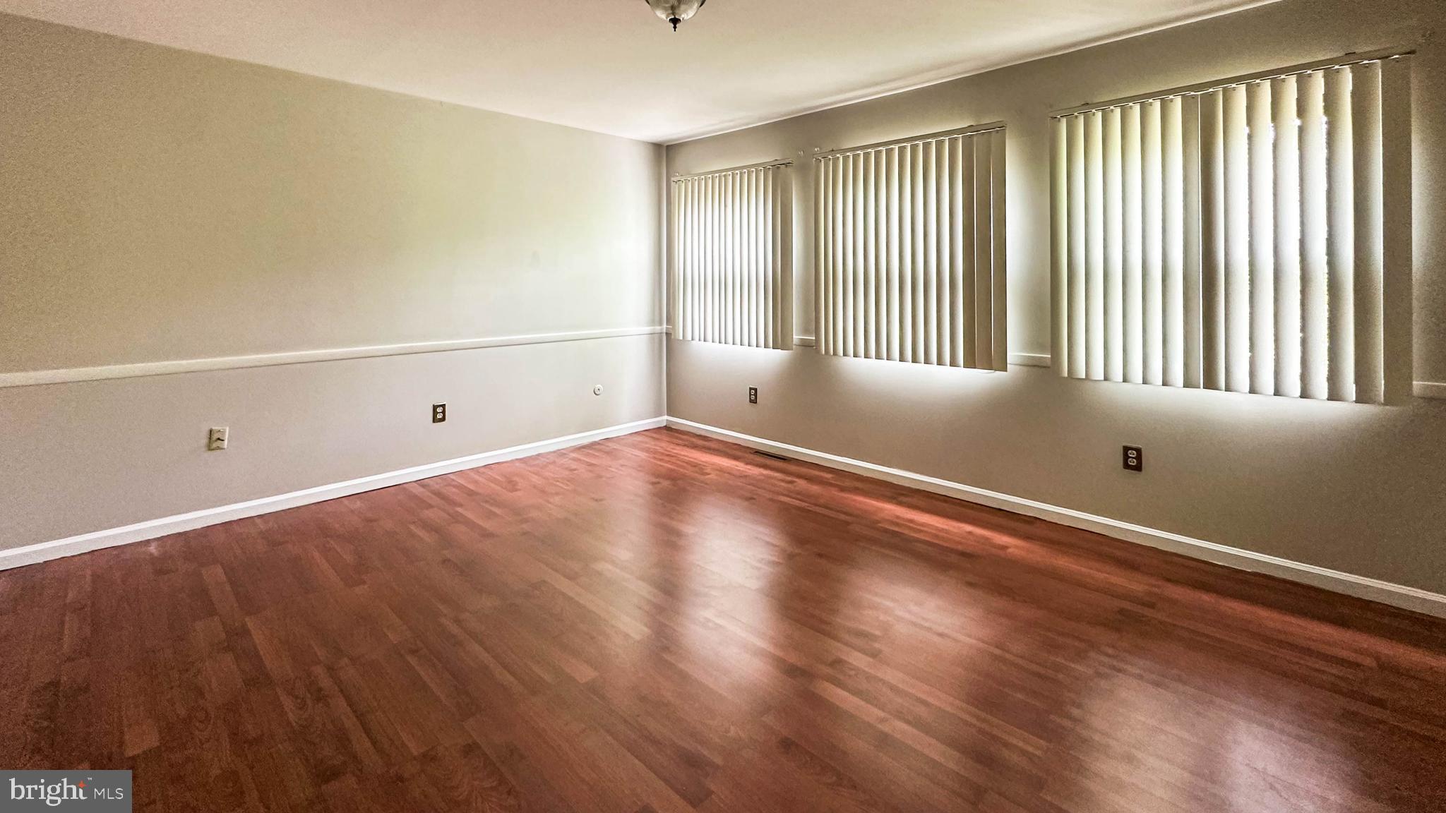 7 Pinehurst Court Reading, PA 19607 - Photo 11 of 11 wooden floor in an empty room with a window