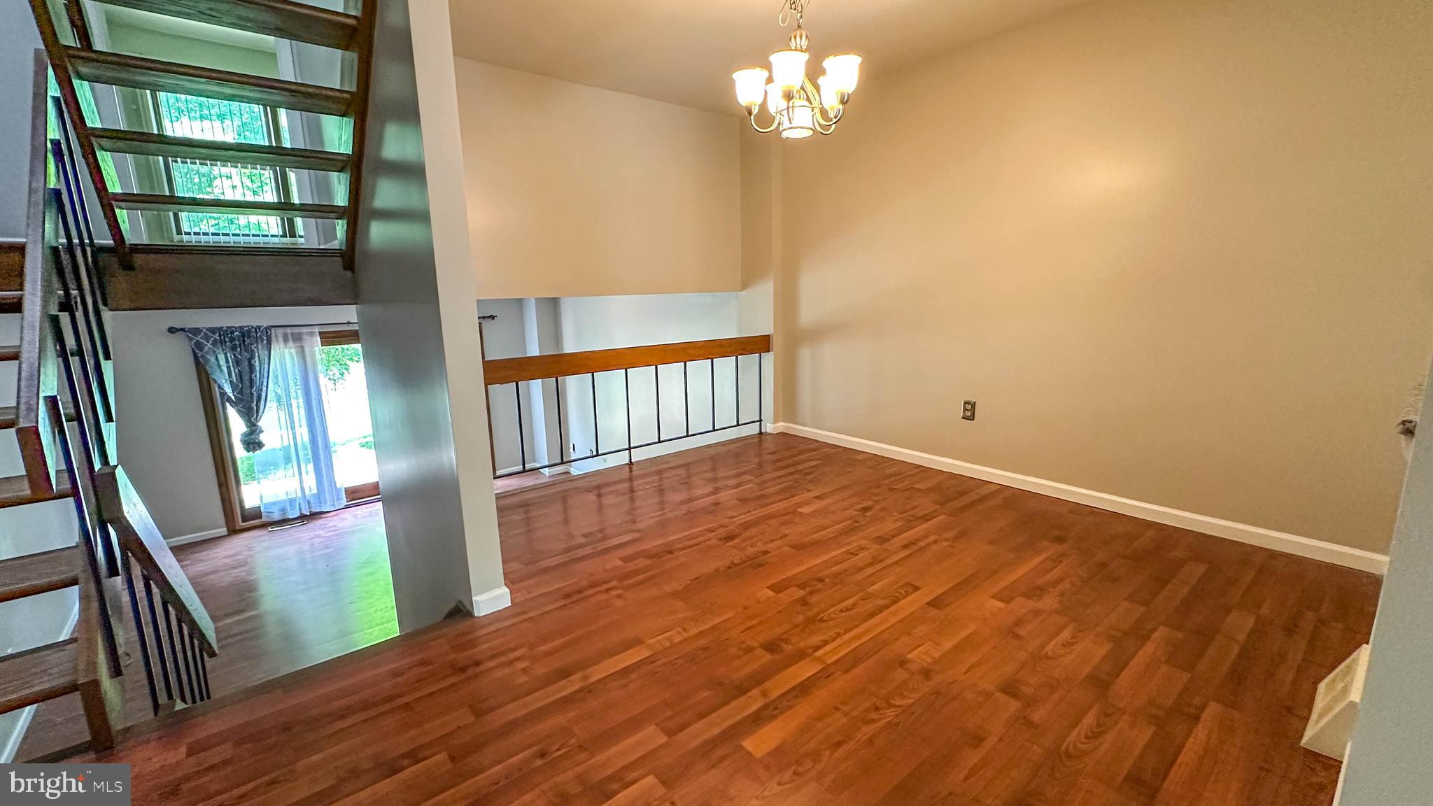 7 Pinehurst Court Reading, PA 19607 - Photo 4 of 11 a view of a livingroom with wooden floor and stairs