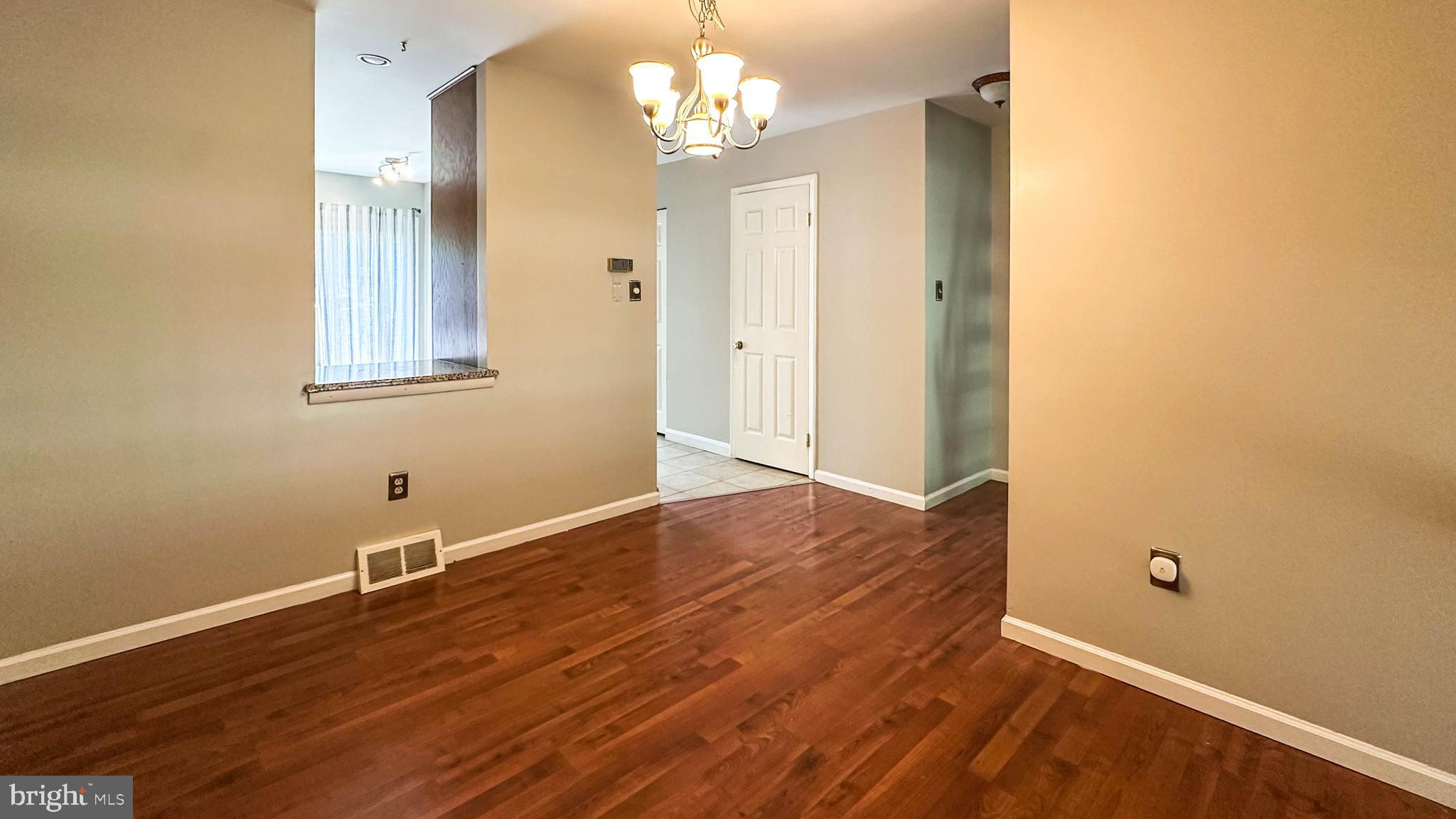 7 Pinehurst Court Reading, PA 19607 - Photo 5 of 11 an empty room with wooden floor and windows