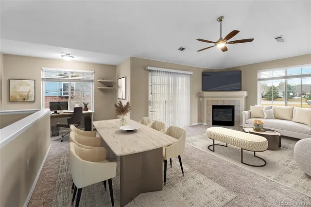 a living room with furniture and a fireplace