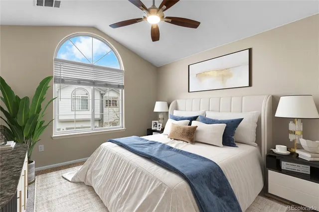 a bedroom with bed and a window