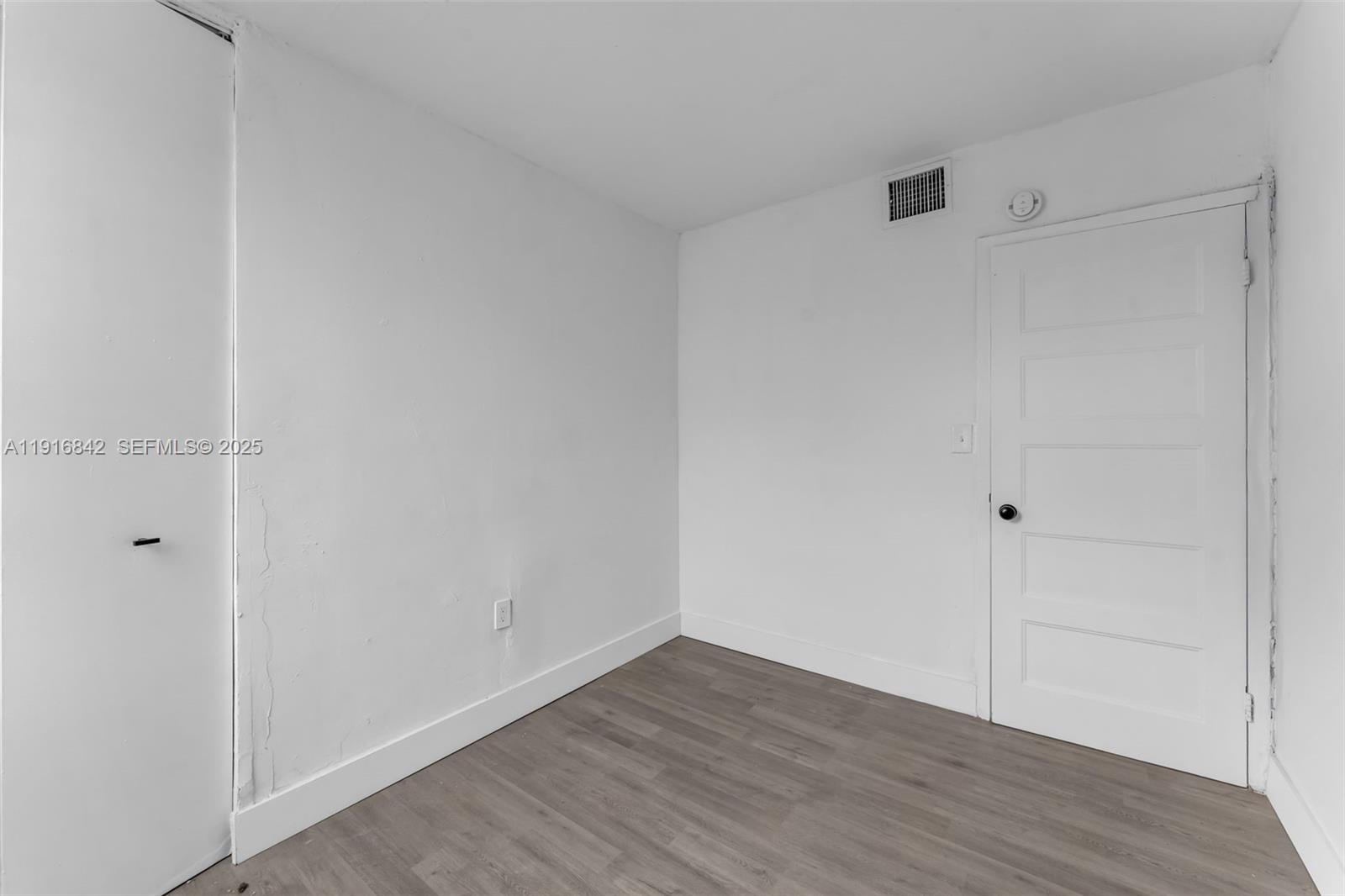 6011 Southwest 69th Street, Unit 72 South Miami, FL 33143 - Photo 18 of 22 a view of an empty room