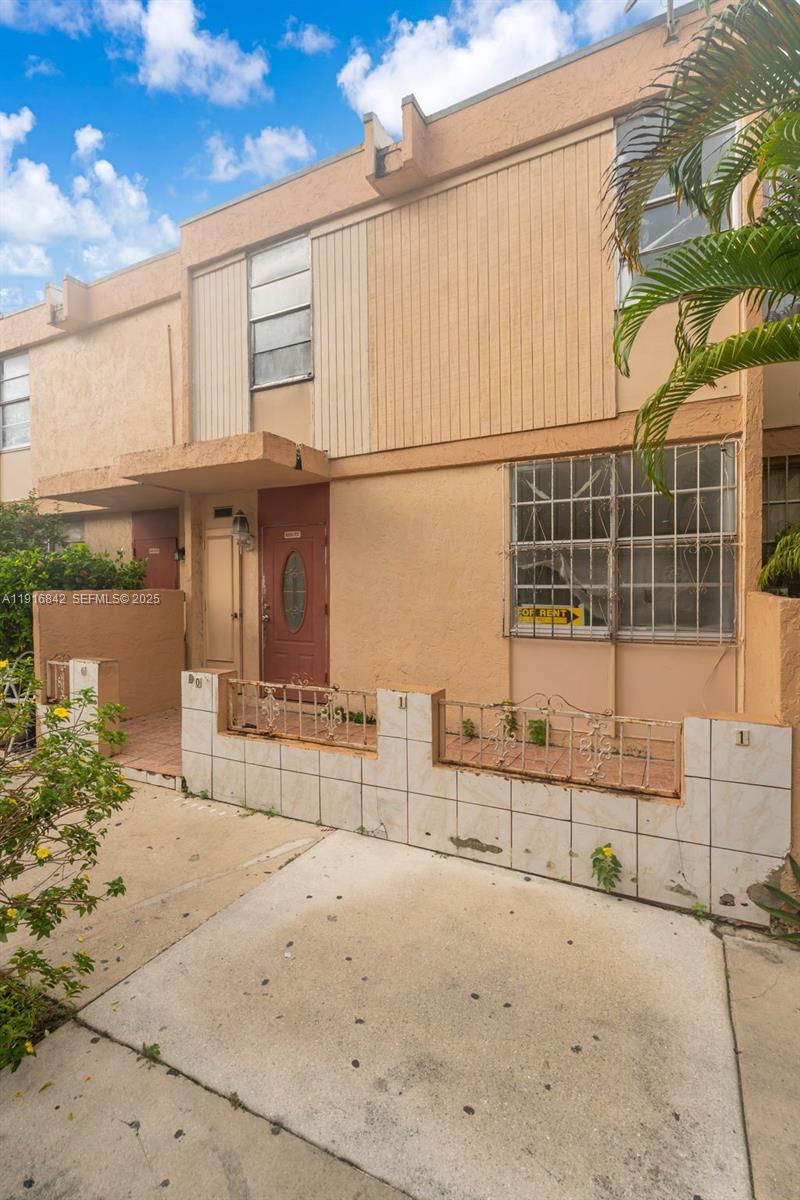 6011 Southwest 69th Street, Unit 72 South Miami, FL 33143 - Photo 3 of 22 a view of a house with a outdoor space