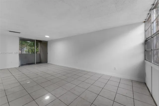 a view of an empty room and window