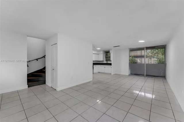 a kitchen with a sink and a stove top oven