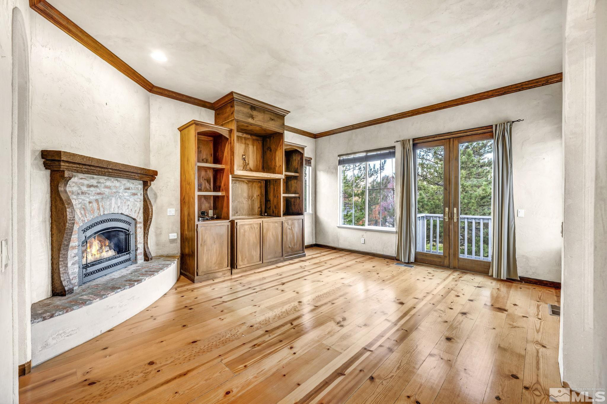 1657 Aspen Creek Road Reno, NV 89519 - Photo 16 of 40 a view of a livingroom with a fireplace and a window