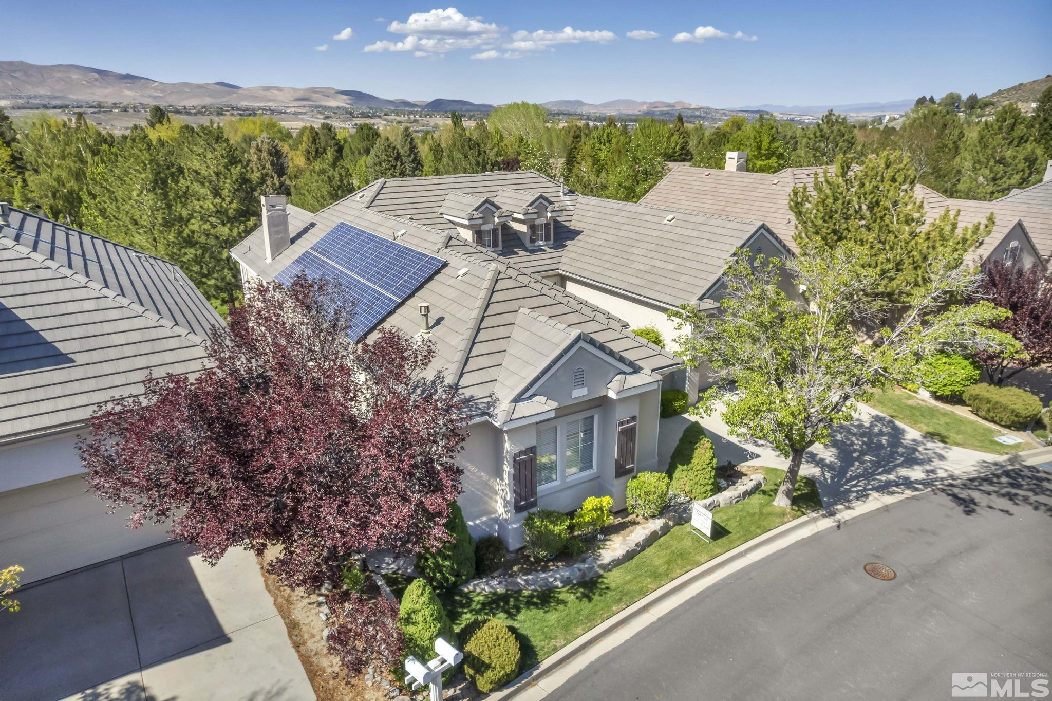 1657 Aspen Creek Road Reno, NV 89519 - Photo 4 of 40 a view of a house with a yard and garden