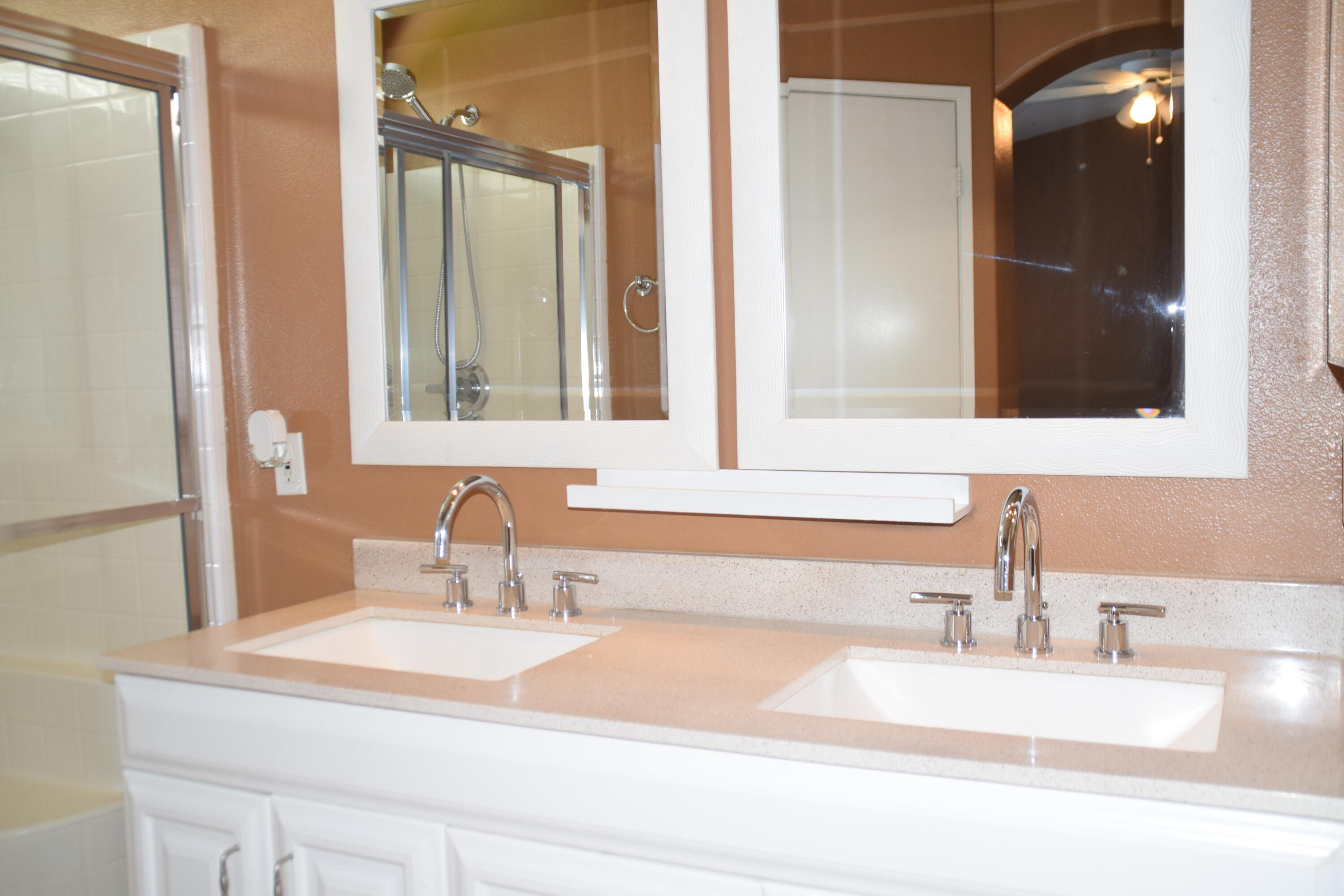 83793 Pacifica Sur Indio, CA 92203 - Photo 19 of 22 a bathroom with a sink and a mirror