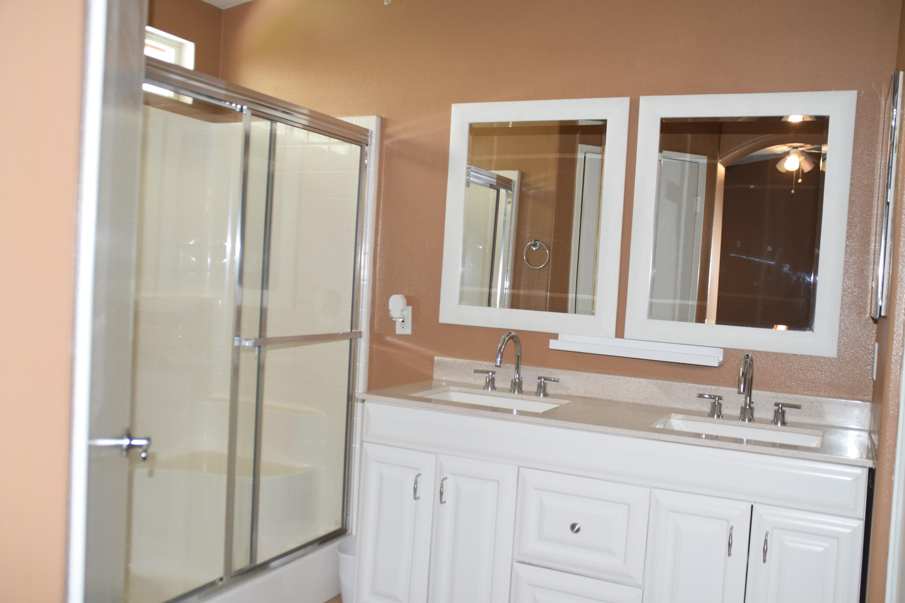 83793 Pacifica Sur Indio, CA 92203 - Photo 20 of 22 a bathroom with a double vanity sink mirror and shower