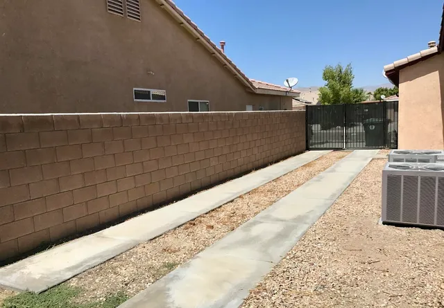 a view of potted plant in front of a building