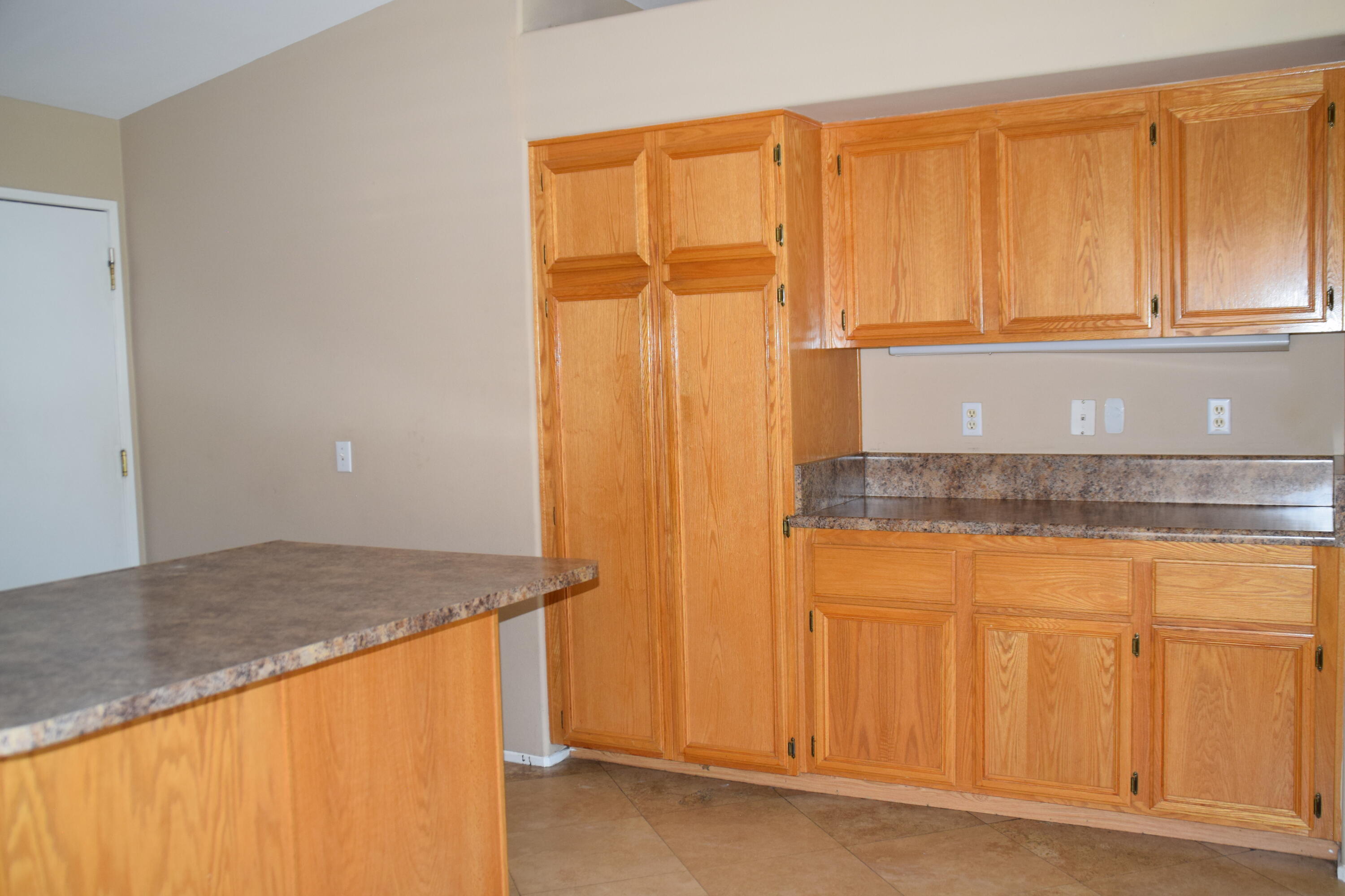 83793 Pacifica Sur Indio, CA 92203 - Photo 7 of 22 a view of a kitchen with wooden floor
