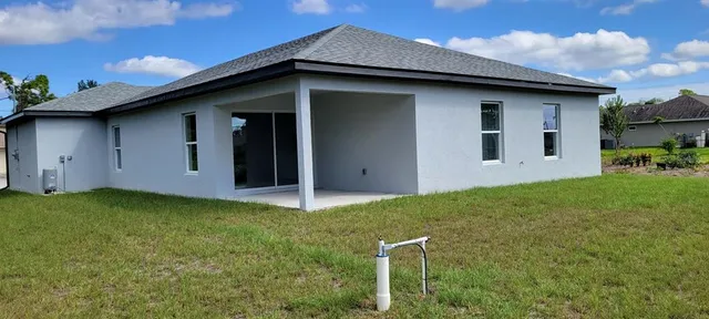 a view of residential houses with outdoor space
