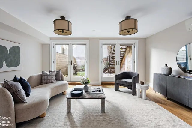 front view of a house with a tree