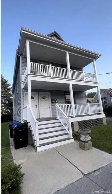 View of front of house with a balcony