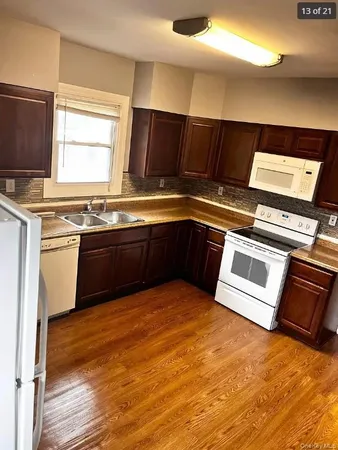 a view of kitchen with wooden floor