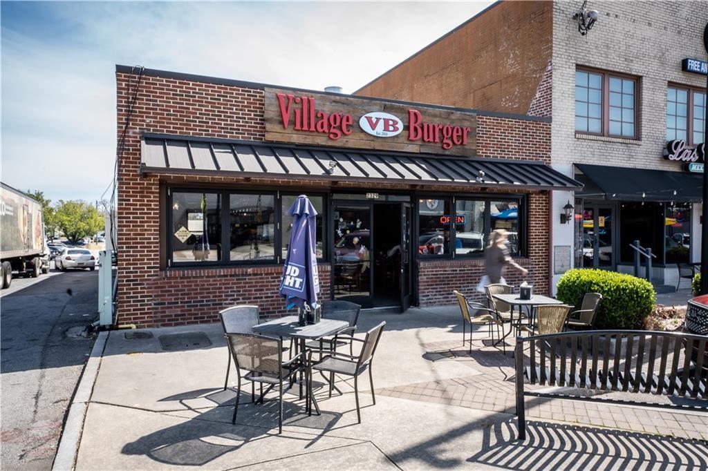911 East Green Lane Clarkston, GA 30021 - Photo 41 of 43 a view of a cafe with a table and chairs in patio