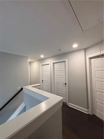 a white toilet sitting next to a sink