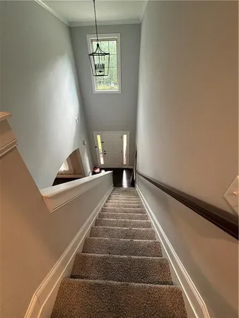 a view of balcony and hall with wooden floor