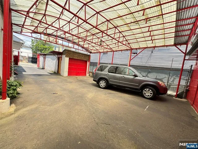 a view of a cars park in front of house