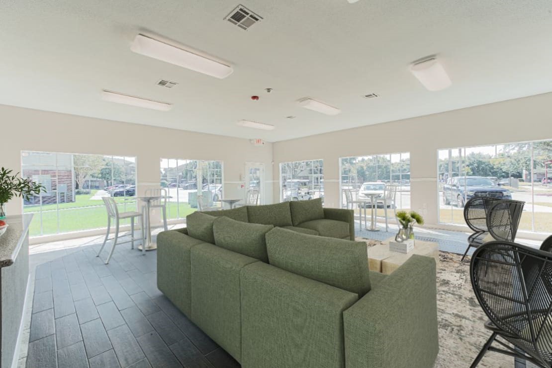 11111 West Montgomery Road, Unit 425 Houston, TX 77088 - Photo 16 of 18 a living room with furniture and a large window