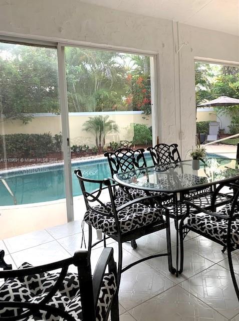 8181 Horseshoe Bay Road Boynton Beach, FL 33472 - Photo 18 of 41 a view of a dining room with furniture window and outside view