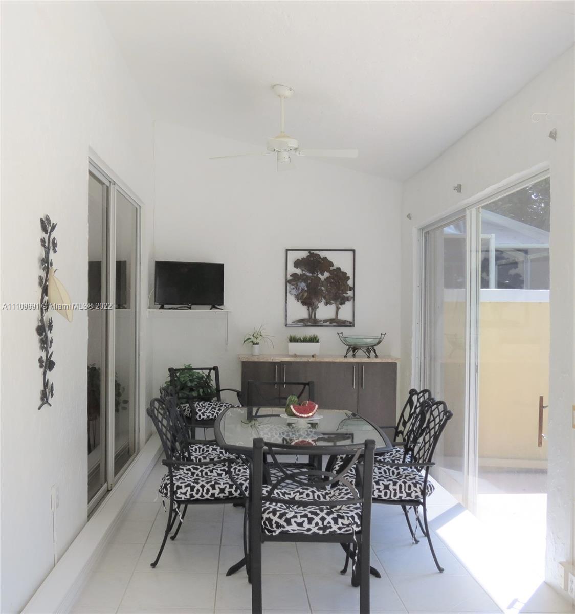 8181 Horseshoe Bay Road Boynton Beach, FL 33472 - Photo 19 of 41 a dining room with furniture and window