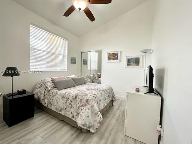 8181 Horseshoe Bay Road Boynton Beach, FL 33472 - Photo 23 of 41 a bedroom with a bed and a chair