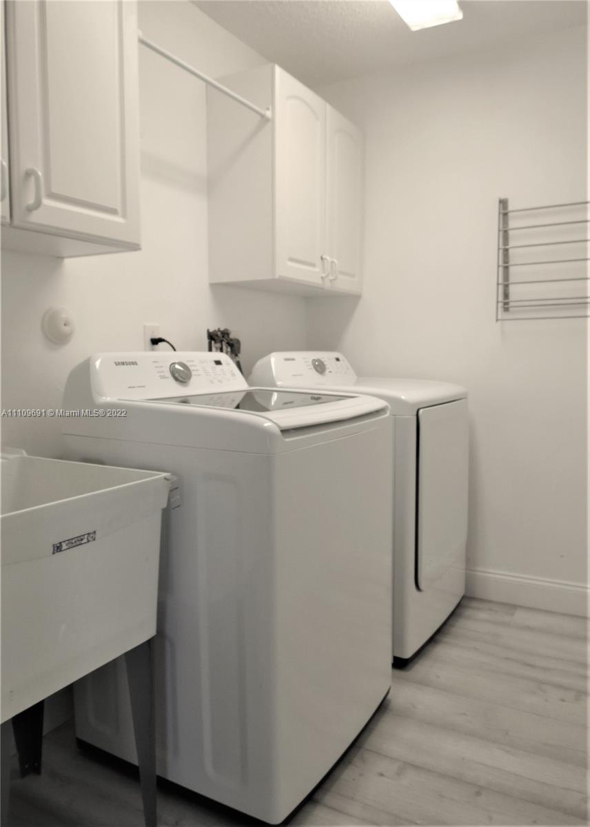8181 Horseshoe Bay Road Boynton Beach, FL 33472 - Photo 24 of 41 a utility room with dryer and washer