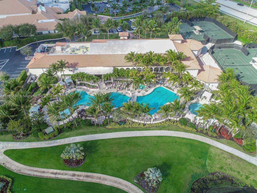 8181 Horseshoe Bay Road Boynton Beach, FL 33472 - Photo 32 of 41 a view of a swimming pool with a garden