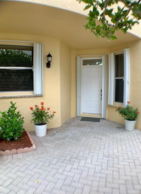 8181 Horseshoe Bay Road Boynton Beach, FL 33472 - Photo 4 of 41 a front view of a house with a yard