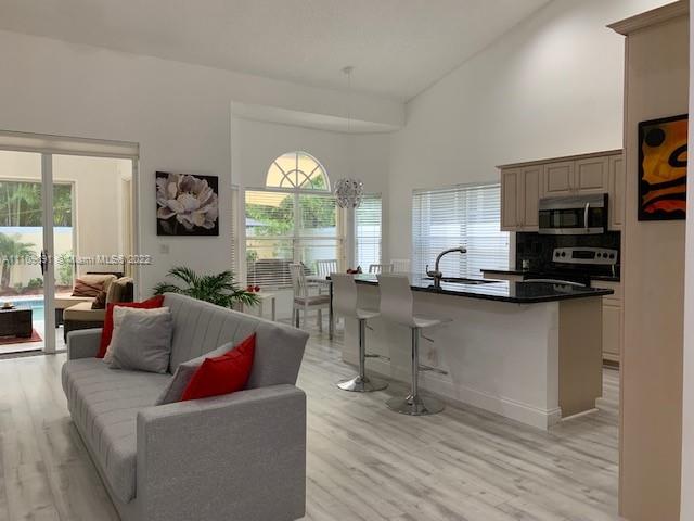 8181 Horseshoe Bay Road Boynton Beach, FL 33472 - Photo 10 of 41 a living room with furniture and a large window