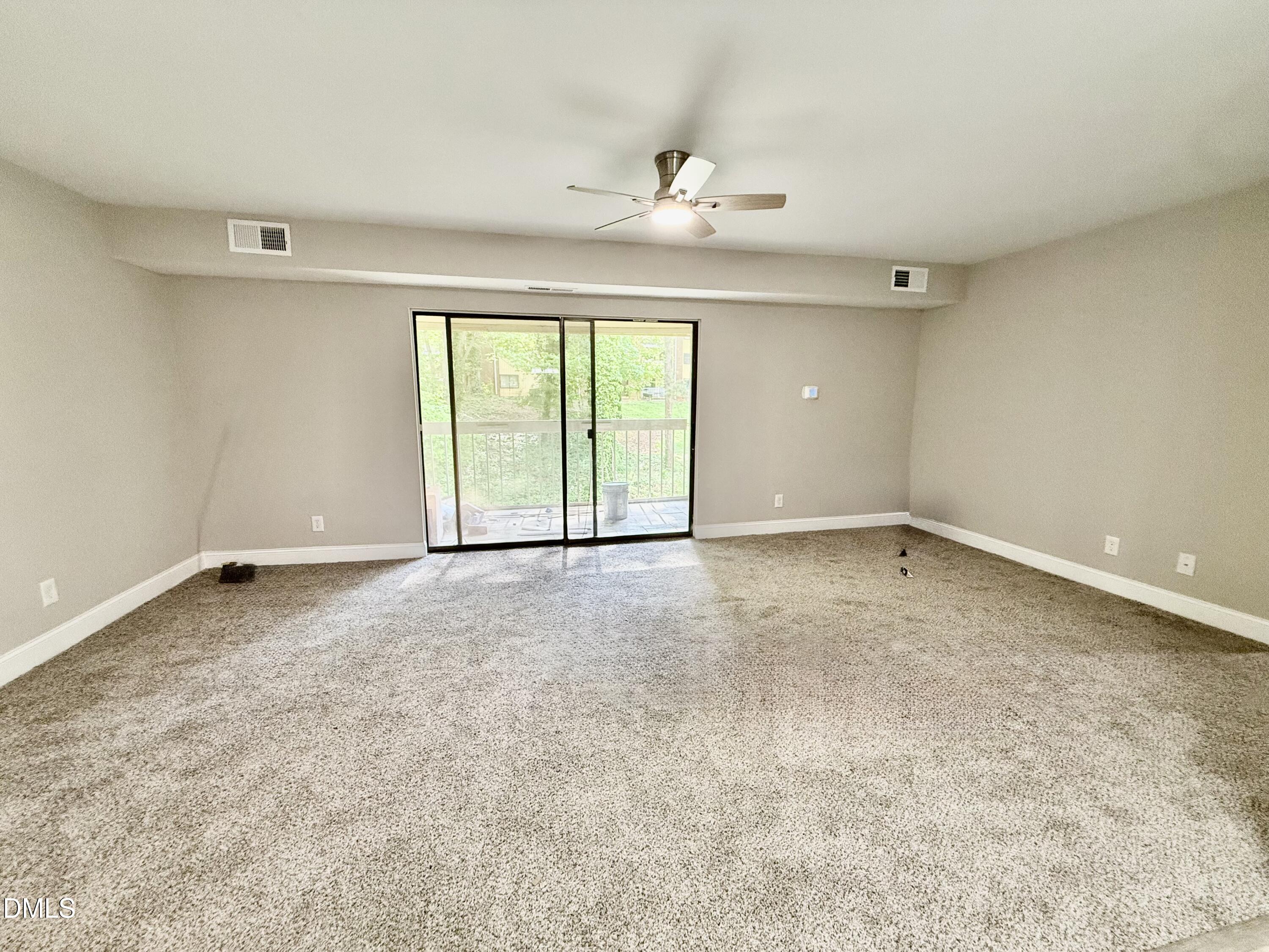 1114 Schaub Drive, Unit I Raleigh, NC 27606 - Photo 5 of 9 a view of an empty room with a window