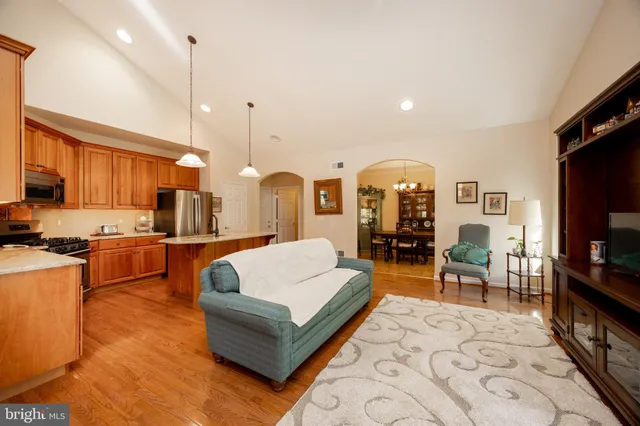 a living room with fireplace furniture and a flat screen tv