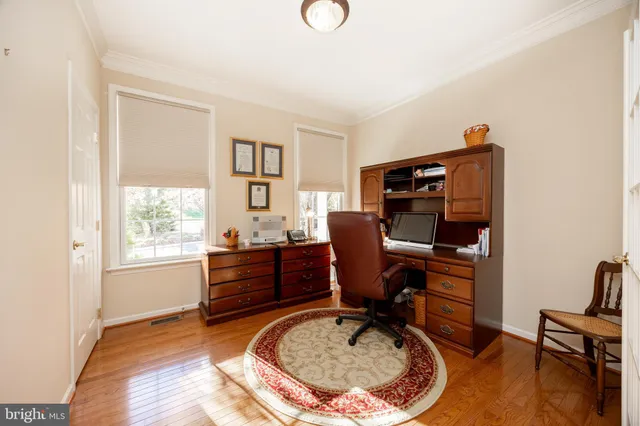 a workspace with furniture and a window