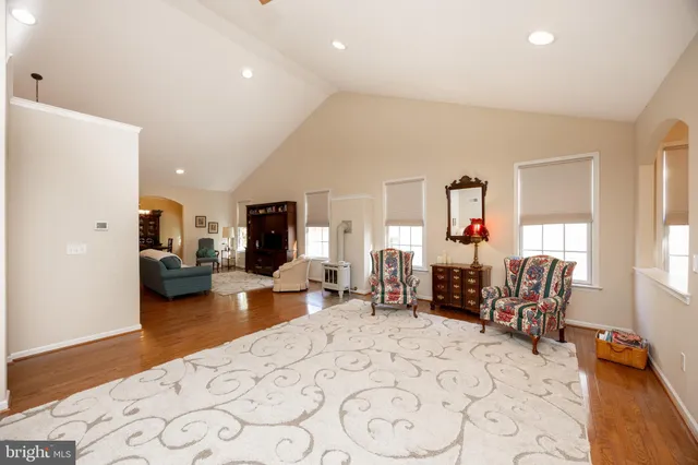a living room with furniture window and a wooden floor