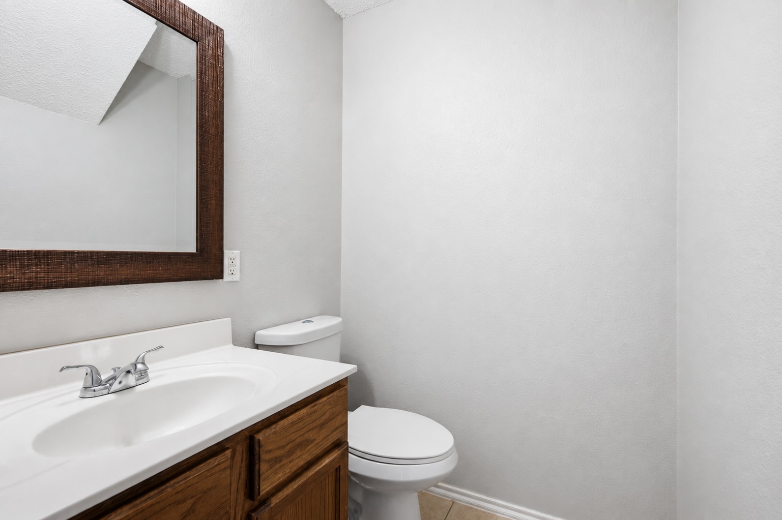 7900 Rosenberry Drive Austin, TX 78747 - Photo 13 of 27 A compact and functional bathroom features a single vanity and essential fixtures for convenience.