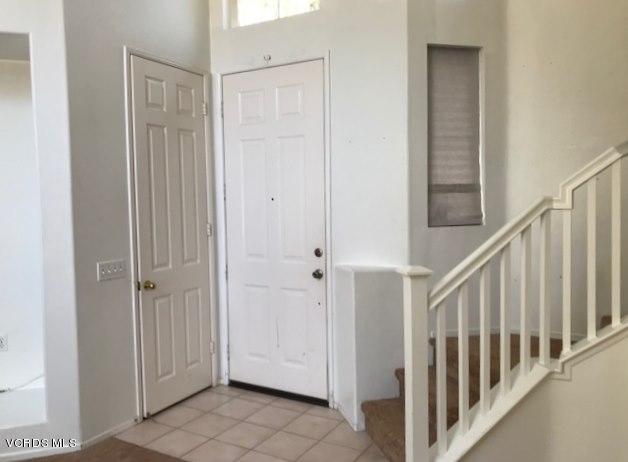 1027 Corte Primavera Oxnard, CA 93030 - Photo 2 of 17 a view of a hallway with wooden floor and entryway